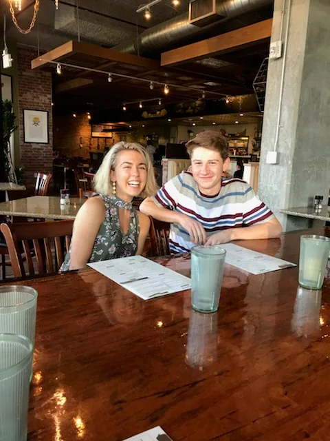 Anna Margaret and Hugh sitting together at a restaurant