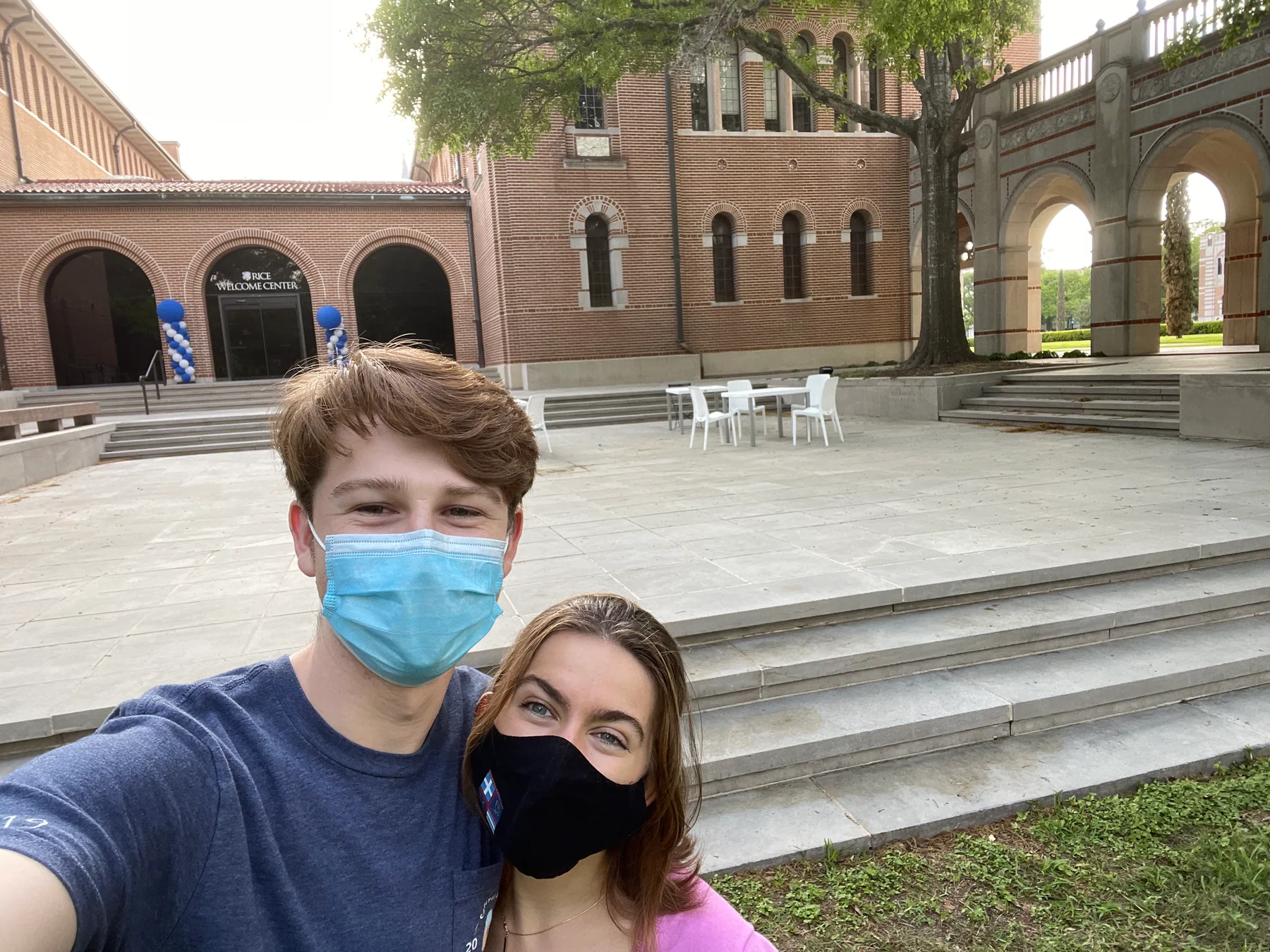 Hugh and Anna Margaret taking a masked selfie outside