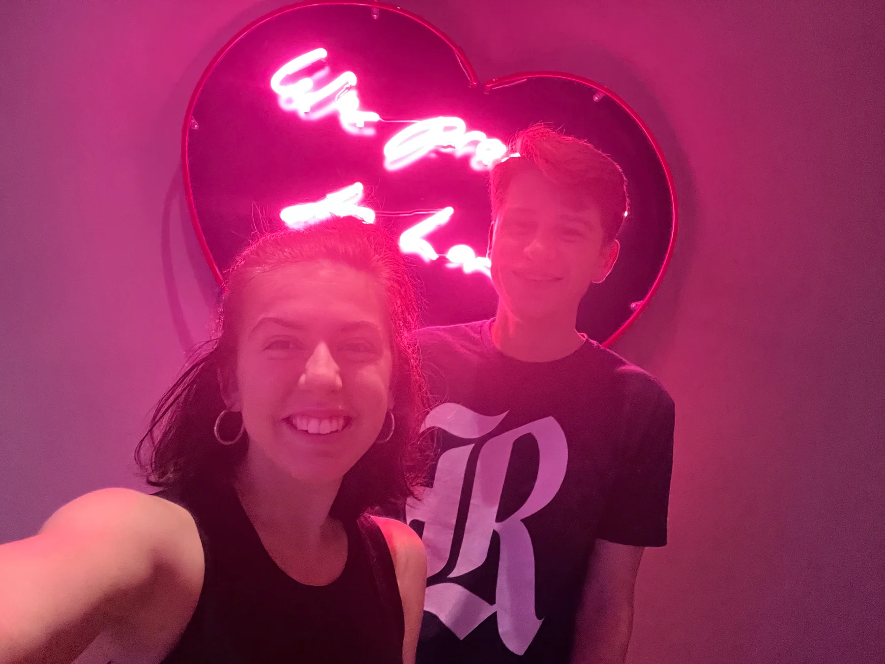 Anna Margaret and Hugh smiling beneath a glowing heart