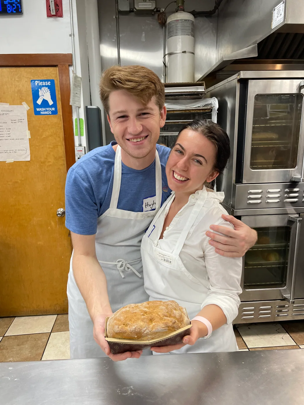 Hugh and Anna Margaret smiling together in a kitchen